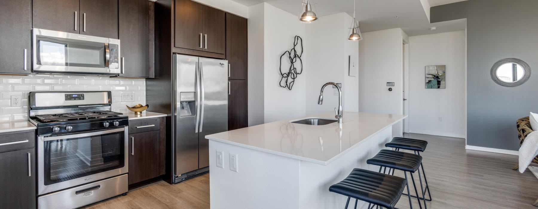 a kitchen with a white counter top