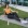 a girl sitting on green turf