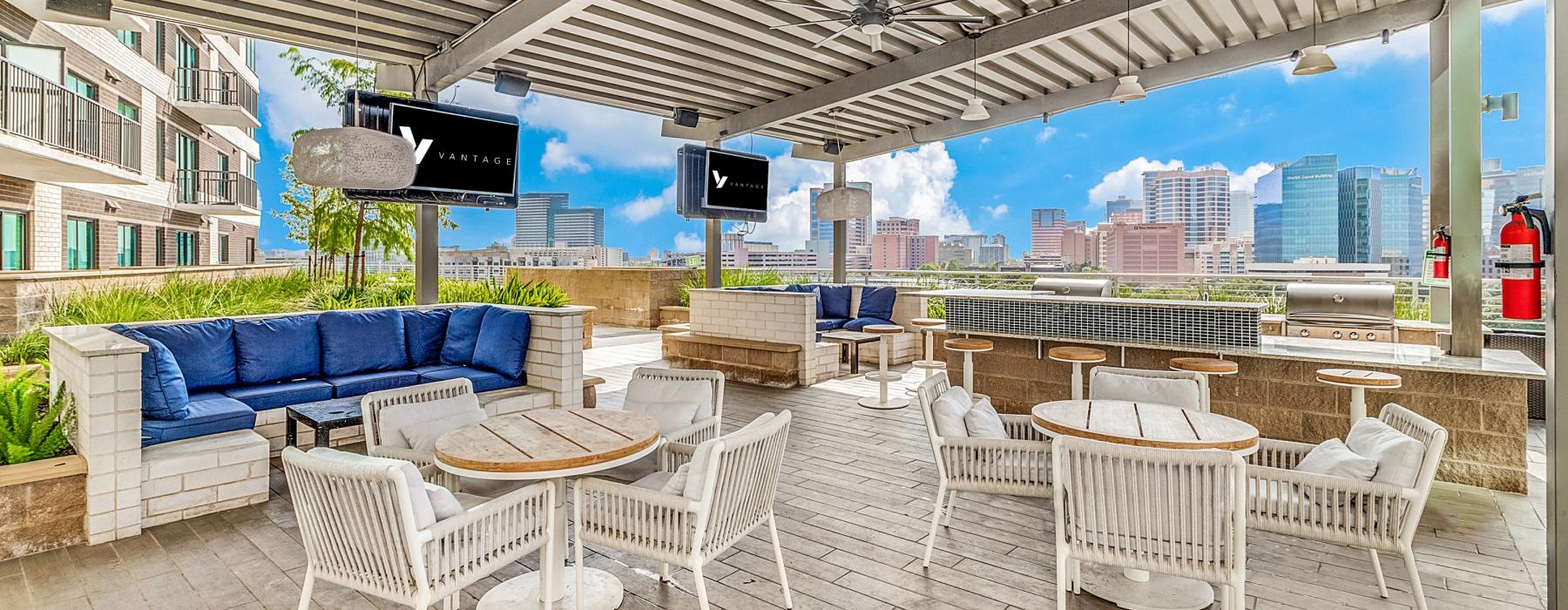 a patio with a table and chairs