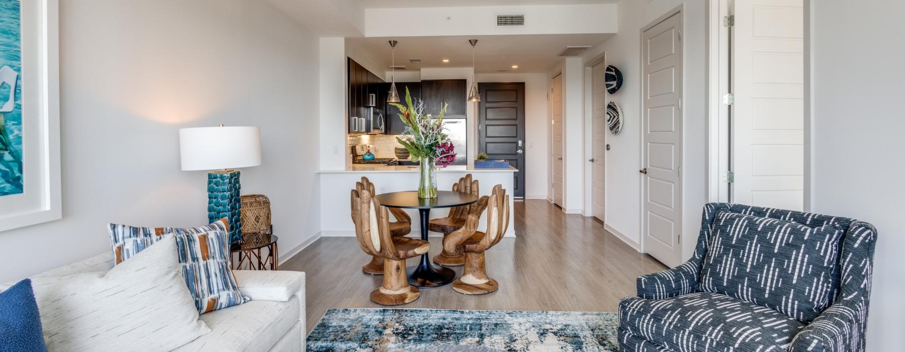 a living room with a table and chairs
