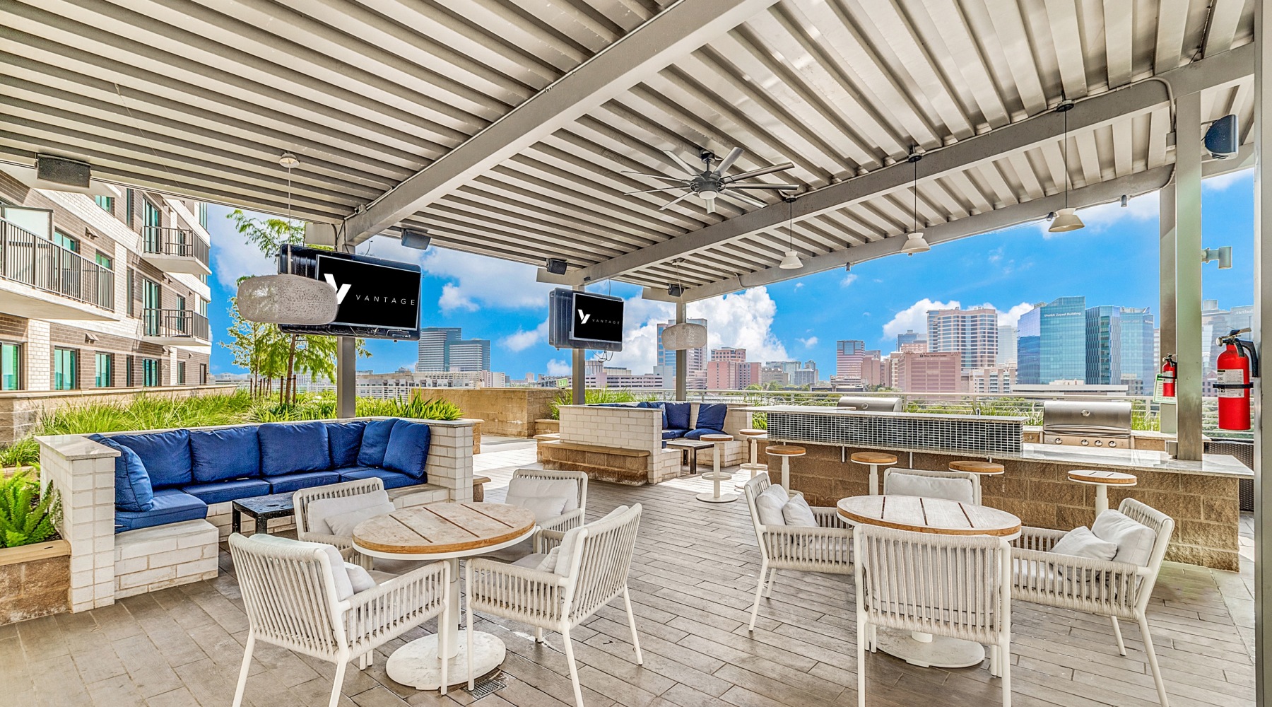 Captivating & Modern outside patio area with a view of the city skyline